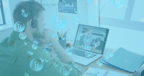 Man on Virtual Call Surrounded by Bitcoin Symbols