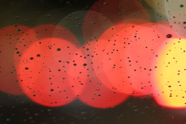 Close-up of Rain Droplets on Window at Night with Colorful Blurred Lights - Download Free Stock Photos Pikwizard.com