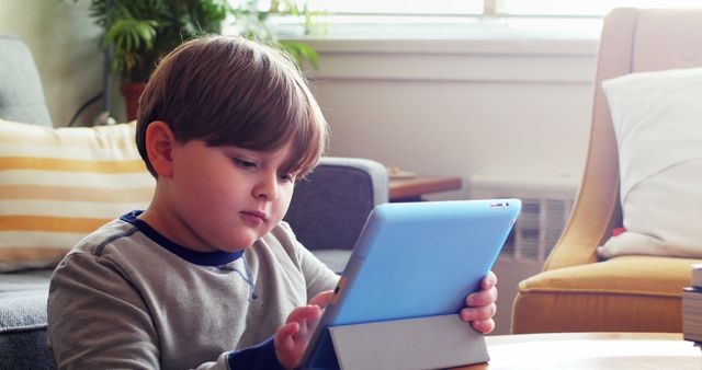 Child Using Digital Tablet at Home - Download Free Stock Images Pikwizard.com