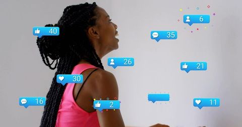 Laughing woman in pink top with braided bun and social media notification bubbles