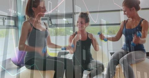 Three women sitting on stability balls holding dumbbells with financial charts overlay