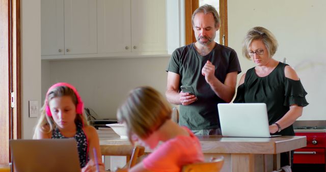 Parents Working from Home While Children Study - Download Free Stock Images Pikwizard.com