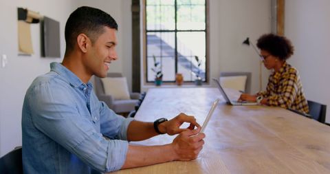 Man Using Tablet Technology in Modern Office