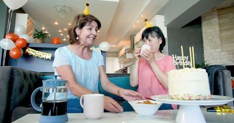 Senior Women Enjoying Birthday Celebration with Cake Had Fun
