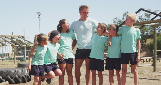 Coach with group of children enjoying outdoor workout together - Download Free Stock Images Pikwizard.com