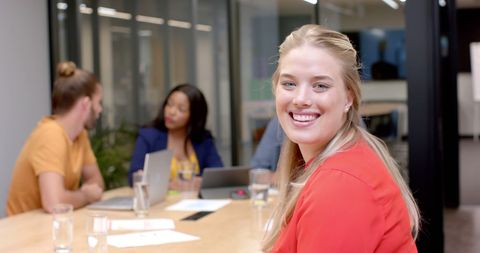 Confident Businesswoman Leading Diverse Team Meeting