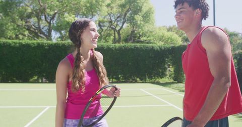 Happy Couple Playing Tennis on Sunny Day