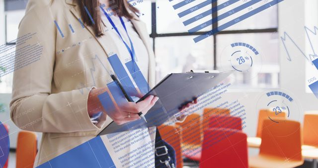 Business Woman Analyzing Financial Data on Clipboard in Conference Room - Download Free Stock Images Pikwizard.com