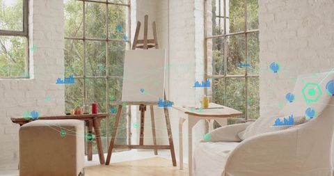 Sunlit loft art studio with wooden easel holding blank canvas and AR data overlays