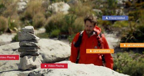 Hiker in Nature with Digital Alerts Overlaid for Exploring Technology