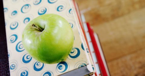 Green Apple on Books Symbolizing Education and Health - Download Free Stock Images Pikwizard.com