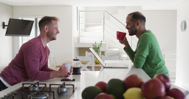 Happy Man Enjoying Coffee Chat in Modern Kitchen - Download Free Stock Images Pikwizard.com