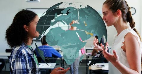 Teen students discussing global issues, collaborating in classroom with globe overlay