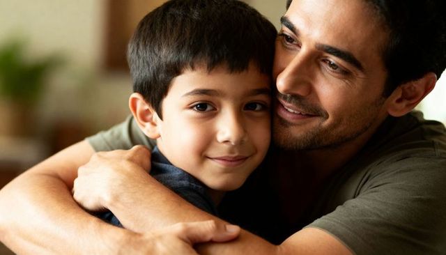Father Hugging Son on Sofa Showing Tender Bond and Parenting Warmth