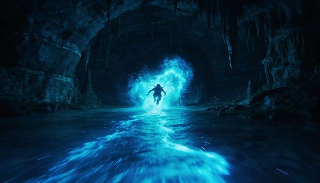 Explorer wading through glowing blue portal in bioluminescent cave with luminous wake