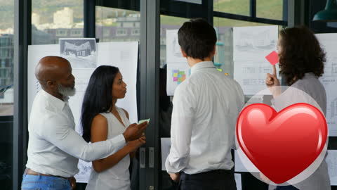 Diverse Team Collaborating on Creative Project in Office Setting