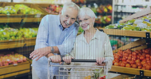 Smiling Senior Couple Shopping in Grocery Store Surrounded by Economic Graphs