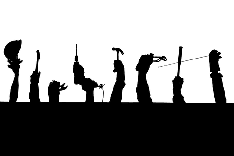 Silhouette of hands holding work tools on transparent background