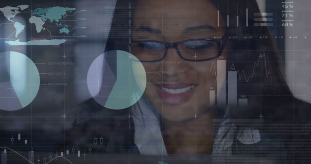 Image of infographic interface over smiling african american woman working on laptop in office. Digital composite, multiple exposure, report, business, global, growth and technology concept.
