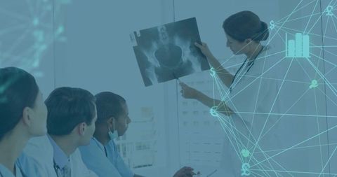 Senior Doctor Presenting Pelvic X-ray in Professional Medical Setting