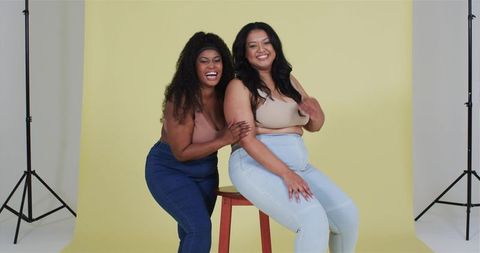 Diverse friends sharing laughter in studio environment