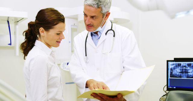 Doctor Discussing Report with Female Patient in Medical Office - Download Free Stock Images Pikwizard.com