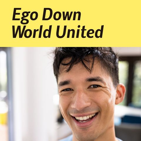 Smiling biracial man signing ego awareness poster
