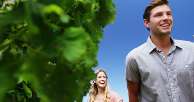 Happy Couple Enjoying Nature Walk in Green Fields and Blue Sky - Download Free Stock Images Pikwizard.com