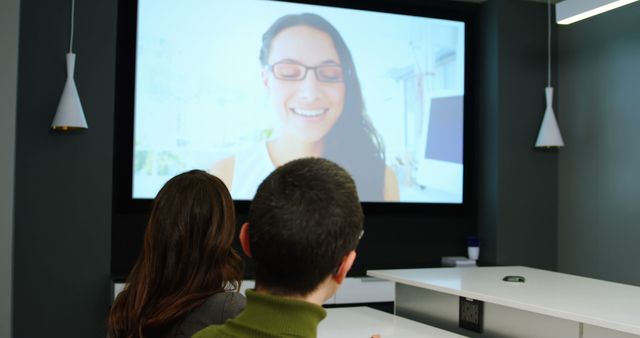 Team Participating in Video Conference Call in Modern Office Setting - Download Free Stock Photos Pikwizard.com