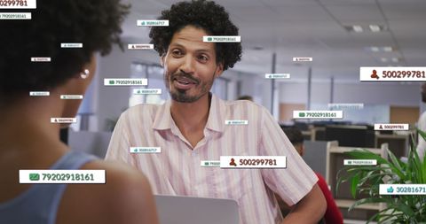 Business colleagues discussing data analysis with digital overlays