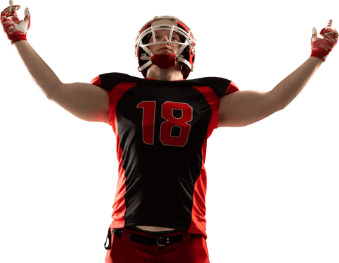 Young american football player celebrating with arms raised transparent