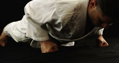 Karate athlete demonstrating fist push-ups