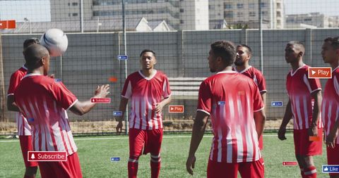 Diverse friends practicing soccer on sunny field