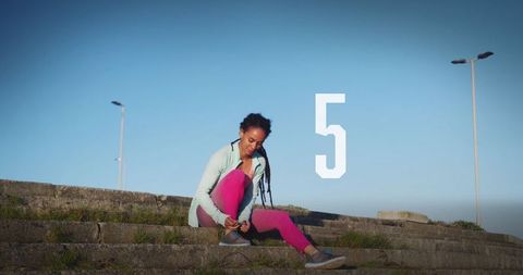 African American Woman Preparing for a Workout Outdoors - Download Free Stock Images Pikwizard.com