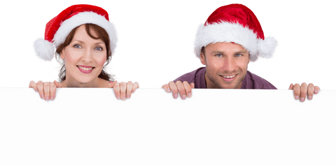 Smiling Couple with Santa Hats and Blank Sign Transparent Background - Download Free Stock Videos Pikwizard.com