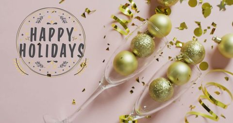 Festive Holiday Greetings with Champagne Glasses and Gold Decorations