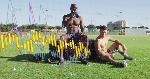 Shirtless athletes resting on grass after training with hydration and fitness data overlay