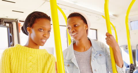 Twin Sisters Interacting on Public Transportation