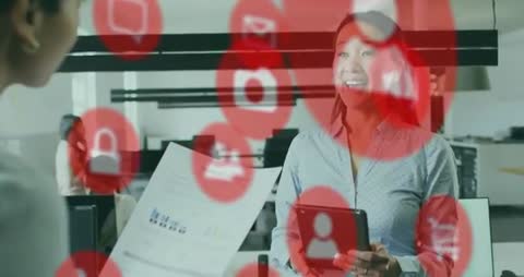 Team Reviewing Quarterly Report on Tablet with Floating Red Communication Icons Overlay