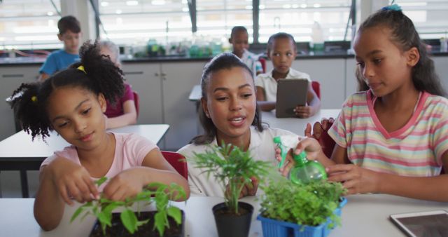 Teacher guiding schoolchildren during hands-on plant study in classroom. Perfect for topics on education, science lessons, classroom activities, hands-on learning, STEM education.