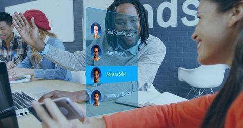 Coworking Team High-Fiving Around Laptop with Holographic Contact Panel and Avatars