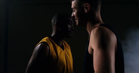 Basketball Players Embracing on Smoky Court - Download Free Stock Images Pikwizard.com