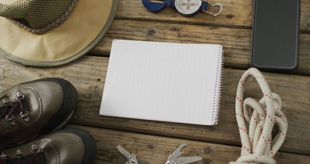 Outdoor Adventure Gear with Notebook on Wooden Table  - Download Free Stock Images Pikwizard.com