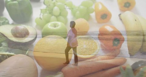 Walking senior woman through oversized fruits in healthy dreamlike coastal double exposure