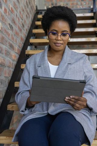 Professional woman with tablet in urban workspace