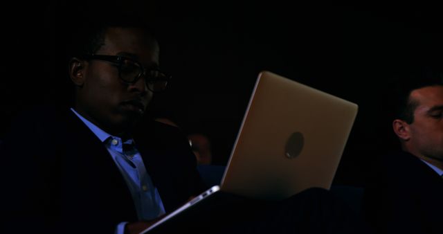 Young Businessman Working Late on Laptop in Dark Office - Download Free Stock Images Pikwizard.com