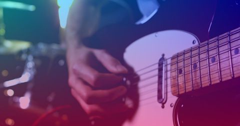 Vibrant Red Light Embracing Electric Guitar Solo Performer