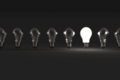 transparent light bulb in dark row inspiration concept - Download Free Stock Videos Pikwizard.com