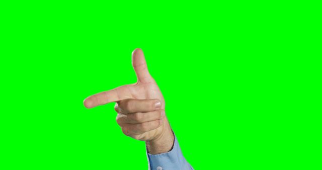 A Caucasian middle-aged man's hand is gesturing with an index finger pointing to the side, against a green screen background with copy space. His gesture could be used to direct attention or indicate something specific in a visual presentation.