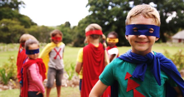 Group of Kids Playing in Superhero Costumes in Park - Download Free Stock Images Pikwizard.com